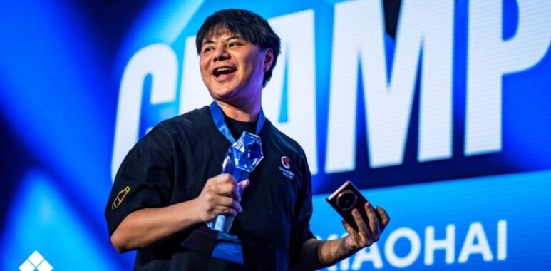 EVO France 2025 FATAL FURY Grand Finals champion XIaohai celebrating on stage following Grand Finals