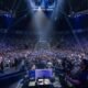 The image shows an esports competition the Evolution Championship Series (Evo), the world's largest fighting game event
