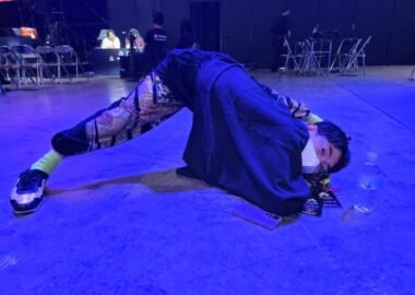 hayao showman posing on stage at evo