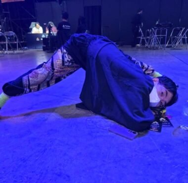 hayao showman posing on stage at evo