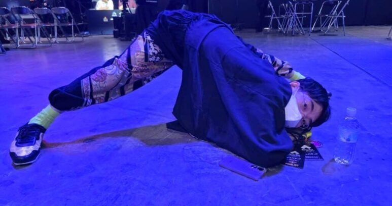 hayao showman posing on stage at evo