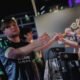 An image showing players from BC.Game shaking hands after a match at an Elisa Esports Counter-Strike event.