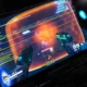 A person wearing a headset playing a first-person shooter game on a monitor.