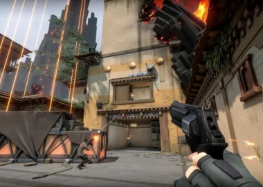 First-person perspective of a player holding a pistol during a match in Valorant.