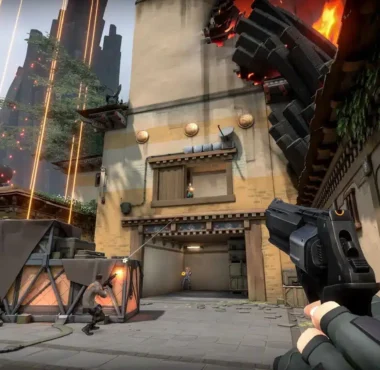First-person perspective of a player holding a pistol during a match in Valorant.