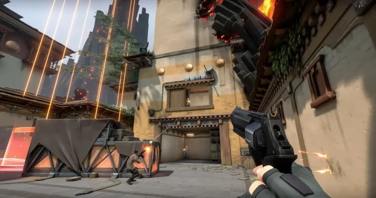 First-person perspective of a player holding a pistol during a match in Valorant.