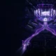 Violet-lit esports arena stage symbolising the completed BLAST Slam VIII playoff bracket