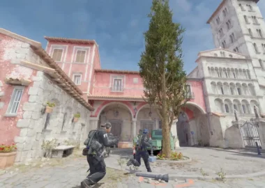 Counter-Strike 2 gameplay showing characters in tactical gear in a Mediterranean-style town square.