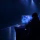 Anonymous esports player at a glowing Dota 2 workstation during a team roster transition