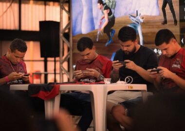 Players competing on smartphones at a mobile esports tournament