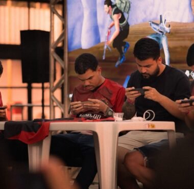Players competing on smartphones at a mobile esports tournament
