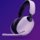 A white and black Sony INZONE gaming headset against a purple gradient background.