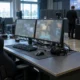 Empty esports tournament station with monitors and equipment after a disciplinary ruling