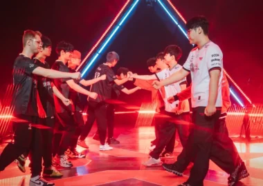 Players from Dragon Ranger Gaming and T1 shaking hands on stage at VALORANT Champions 2025