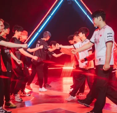 Players from Dragon Ranger Gaming and T1 shaking hands on stage at VALORANT Champions 2025