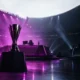 Esports tournament stage lit in violet after a decisive playoff comeback